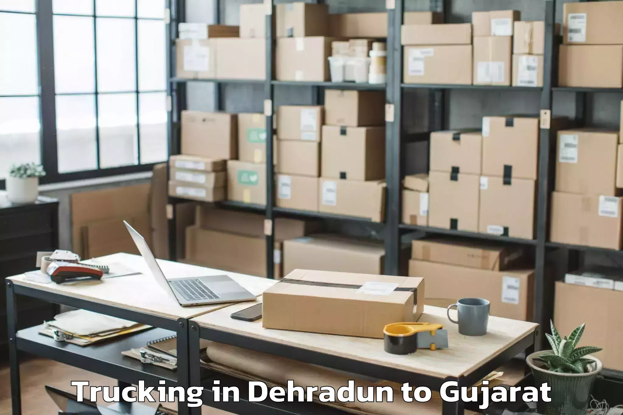 Leading Dehradun to Radhanpur Trucking Provider